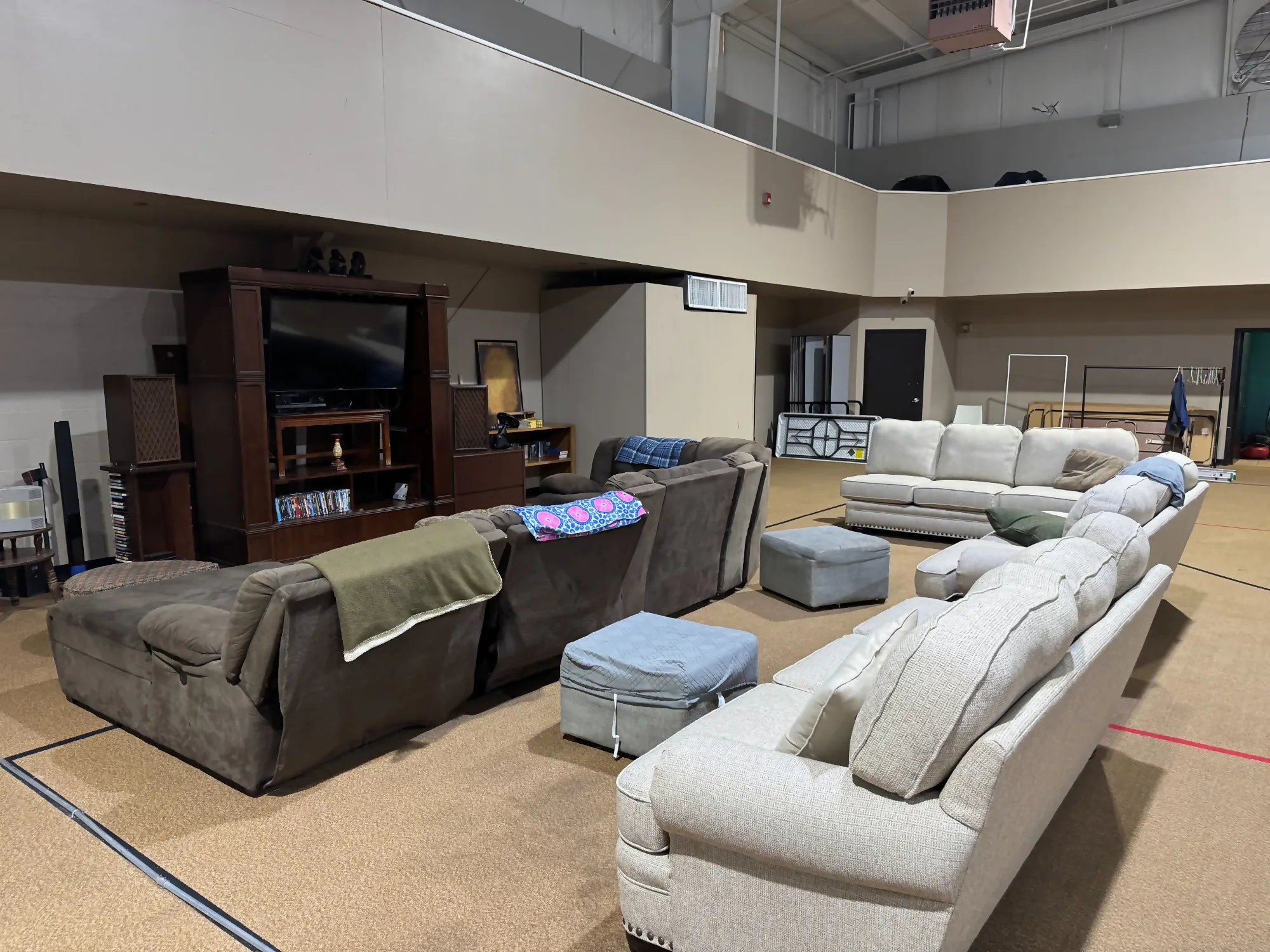 Men's Common Area - Spacious Lounge with Multiple Seating Areas and Entertainment Center