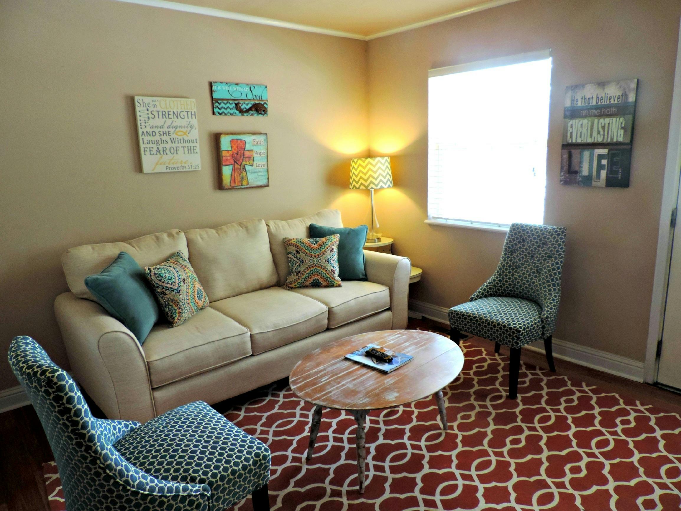 Welcoming Transitional Housing Living Room - Comfortable furnished space with faith-inspired decor